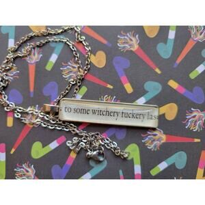 Witchery Fuckery pendant necklace made from The Kiss Curse book pages